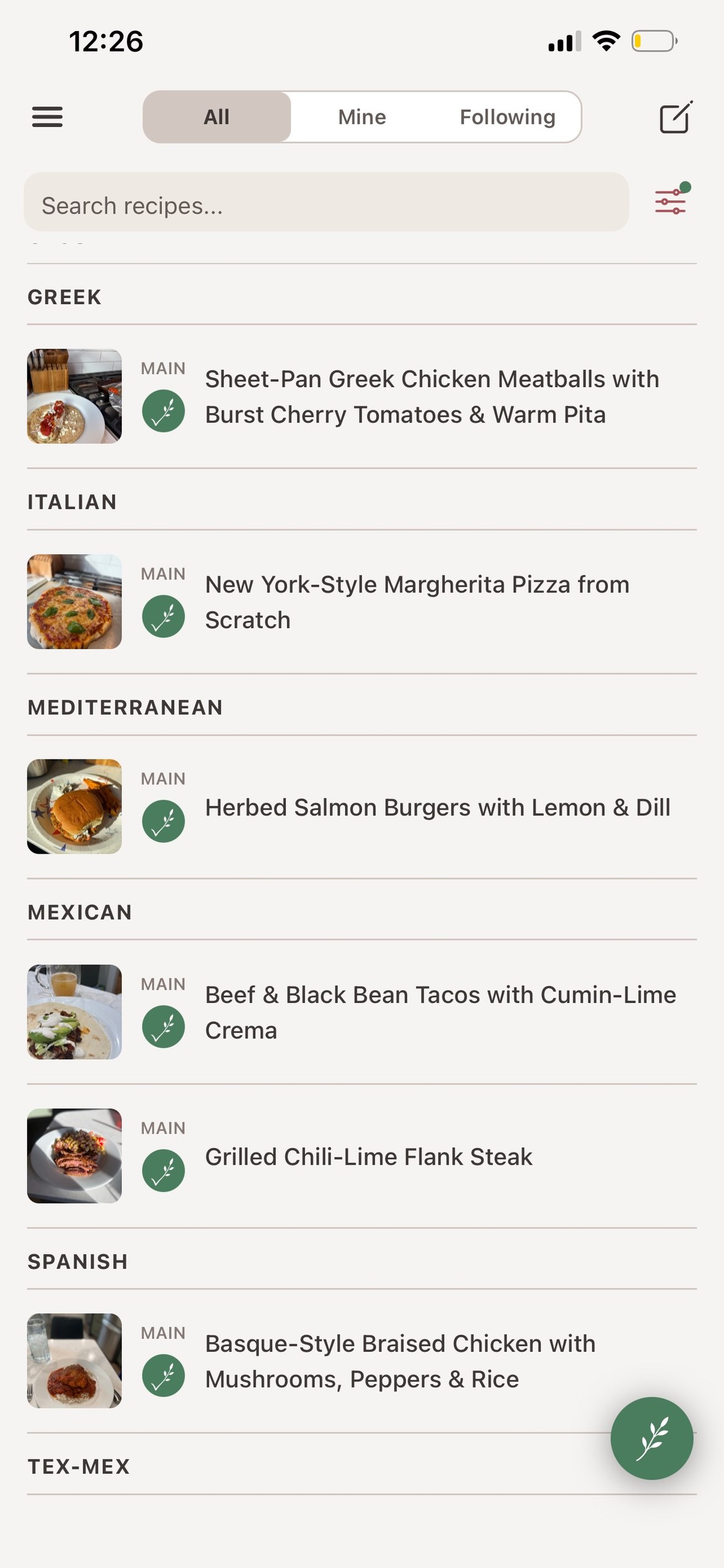 A cookbook library of recipe cards with photos, ratings, and cook times.